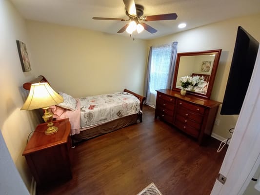 A cozy private bedroom with furniture and decor