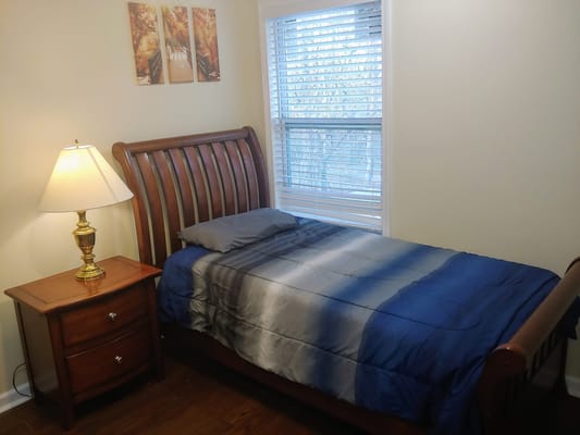 Cozy bedroom setup with a bed and lamp