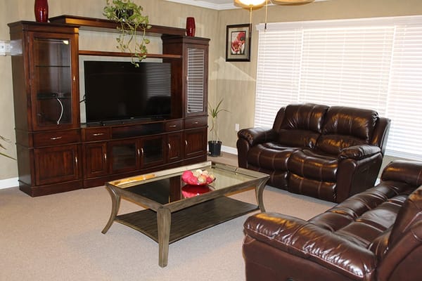 Comfortable living room with couches and TV