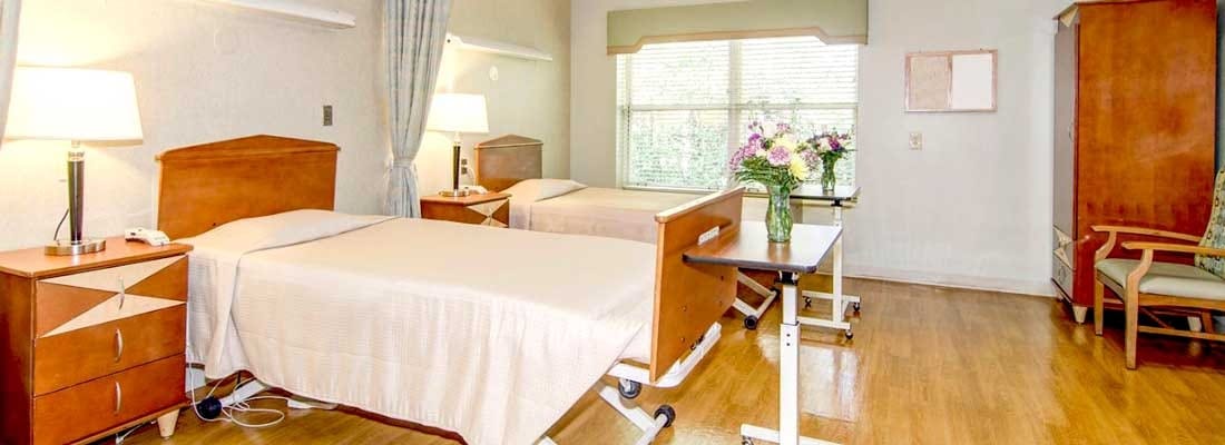 Neat and organized resident bedroom with two beds