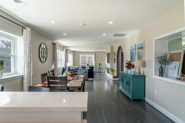 Spacious common area with dining and seating arrangements