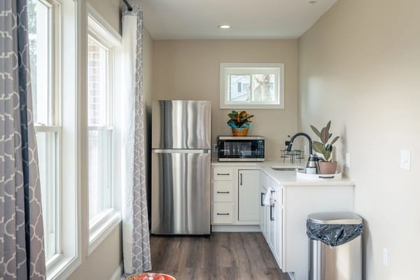 Bright kitchen area with stainless steel appliances