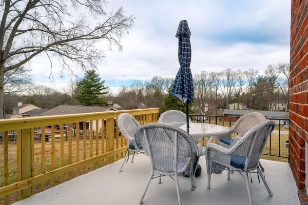 Outdoor patio with seating and umbrella