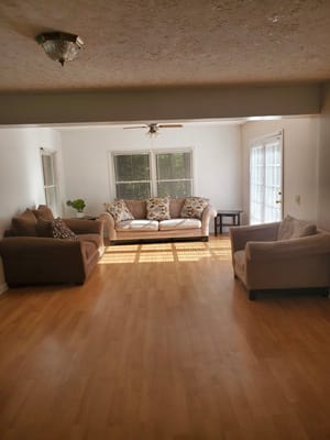 Spacious living room with sofas and natural light