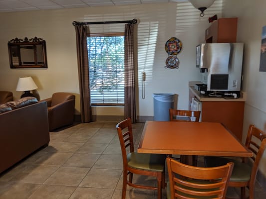Cozy common area with seating and a table