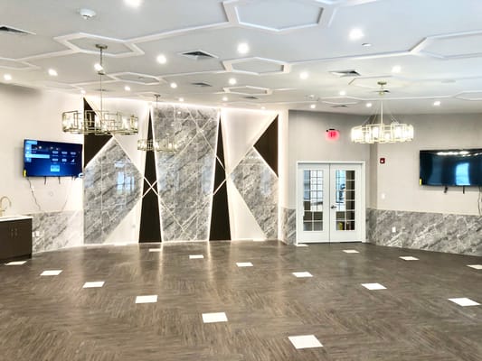 Spacious lounge area with modern decor and lighting