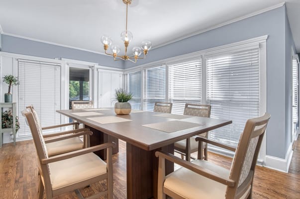 Bright dining room with a wooden table and chairs