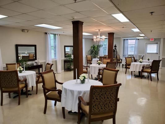Bright dining room with tables set for meals