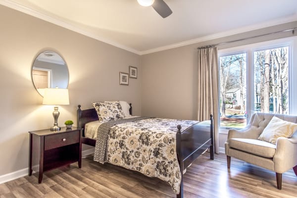 Warm bedroom with floral bedding and natural light