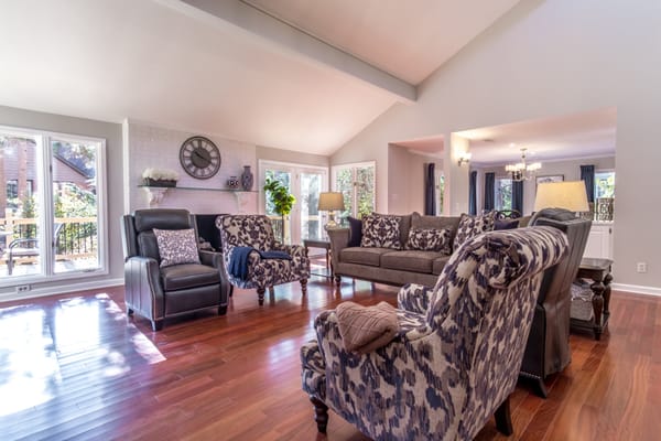 Modern living room with comfortable seating and bright windows