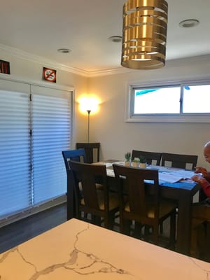 Cozy dining room with a table set for meals