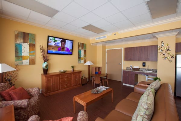 Bright common area with seating and a television