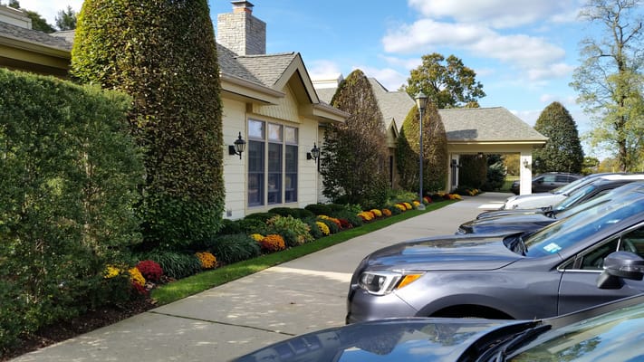 Exterior view of the facility with landscaped entrance