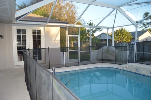Pool area with safety fencing at Violet Gardens Assisted Living Facility