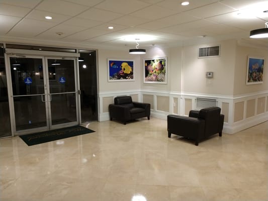 Bright lobby area with comfortable seating and artwork