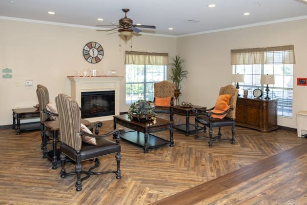 Common area with seating and fireplace