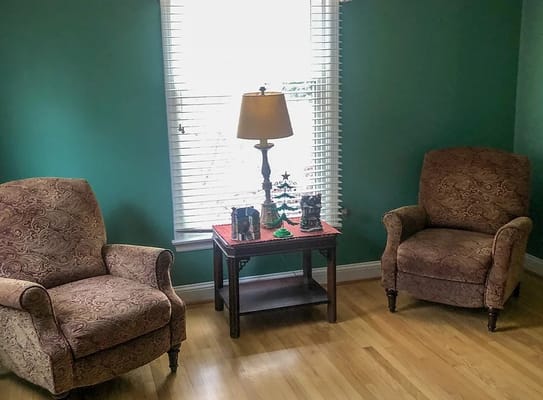 Cozy corner of a room with armchairs and a lamp