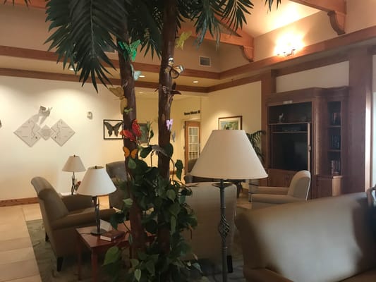 Cozy lobby area with comfortable seating and decorative plants