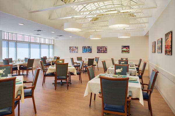 Bright dining area with tables set for meals