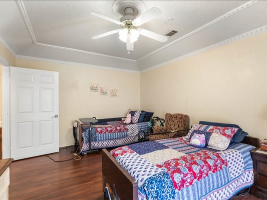 A shared resident room with two beds and decorations