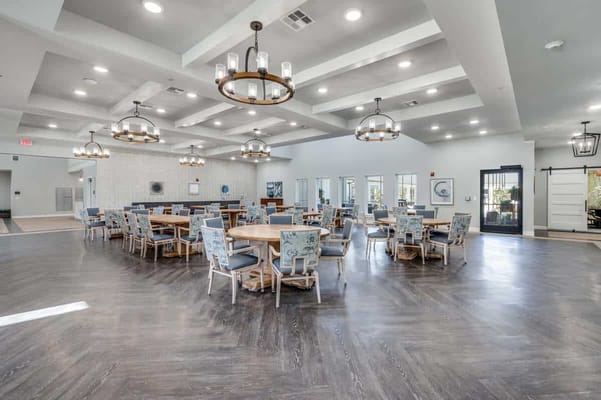 Bright dining area with tables and chairs