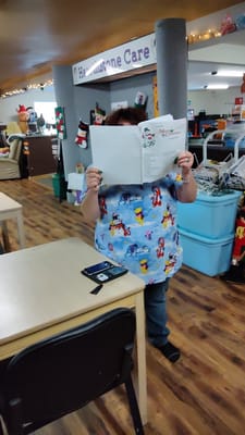 Staff member reading a menu in a common area