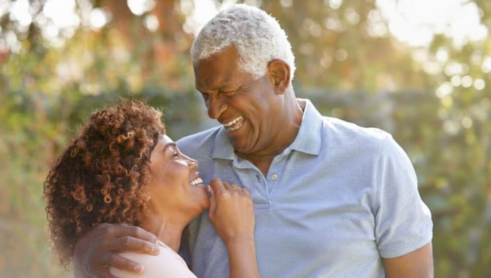 Couple smiling and enjoying outdoor time together