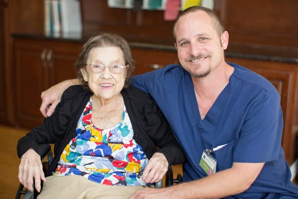 A resident and staff member posing together