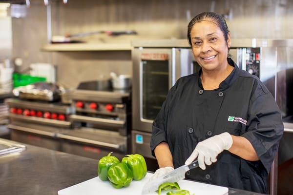 A staff member preparing food in the kitchen