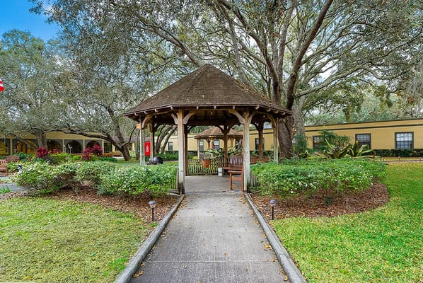 Pathway leading to a gazebo in a landscaped area