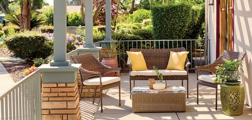 Outdoor seating area with potted plants