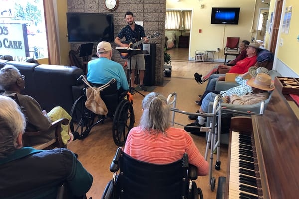 Residents enjoying live music in a common area