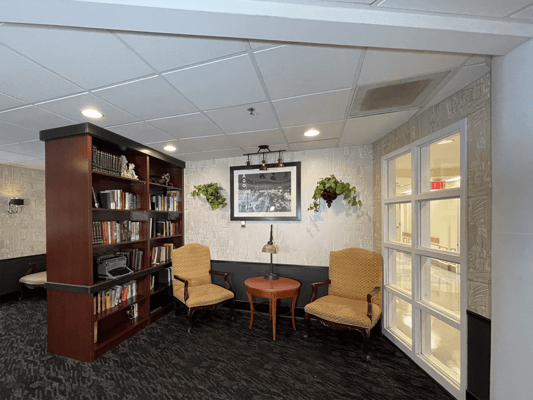Cozy common area with bookshelves and seating
