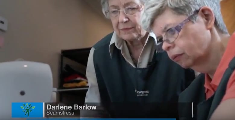 Residents participating in a sewing activity together