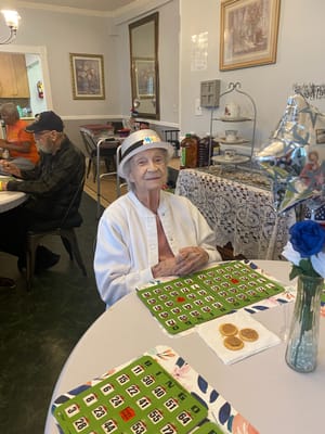 Resident enjoying bingo in a common area