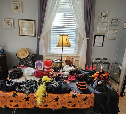 A table with various costumes and hats for activities