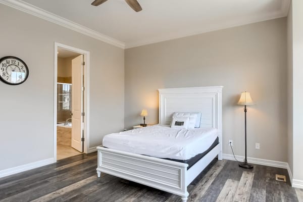Bright interior of a private resident room with a bed