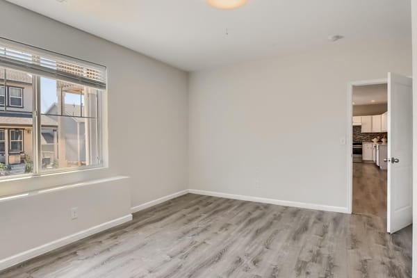 Bright, empty interior room with a large window
