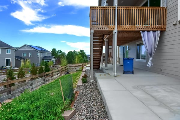 Patio area with garden space and stairs