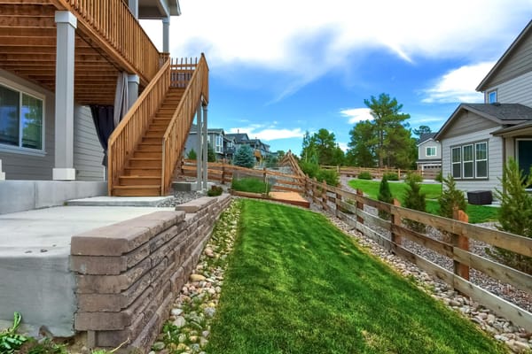 Pathway with landscaped greenery and fencing