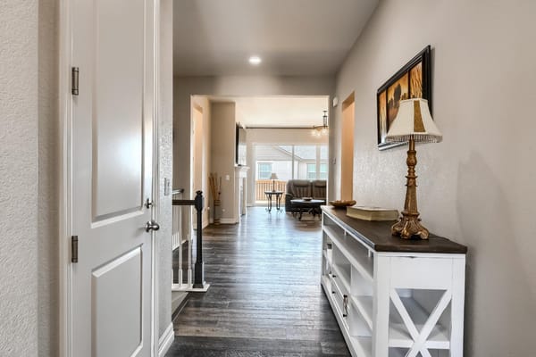 Interior view of a hallway leading to a seating area