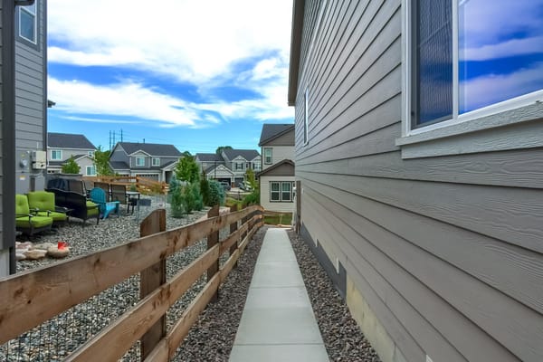 Pathway leading through an outdoor area with seating