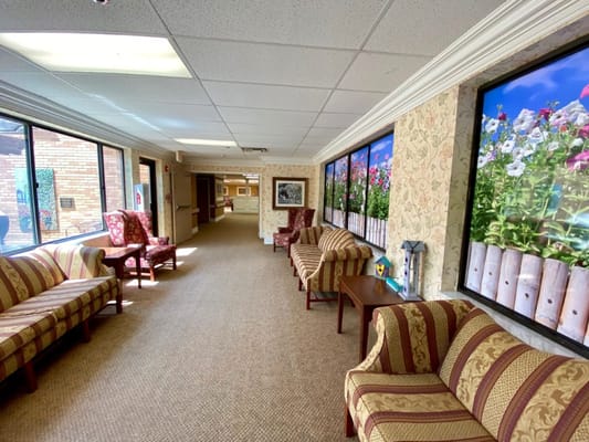 Bright interior hallway of a senior living facility
