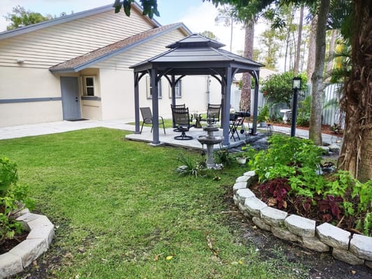 Garden area with a gazebo and seating