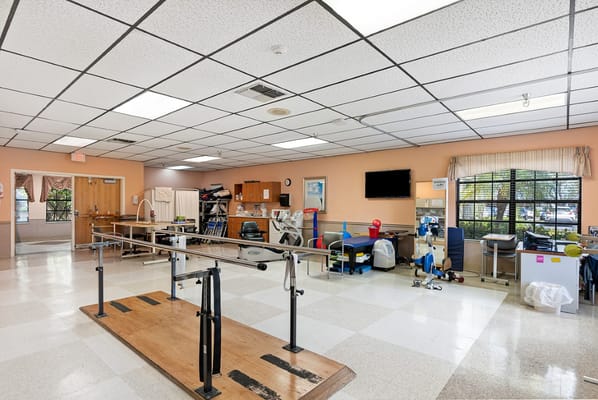 Physical therapy room with equipment for senior residents