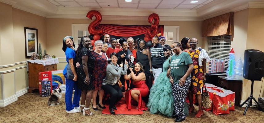 Residents and staff celebrating together in a common area