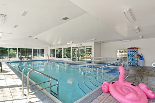 Indoor pool area with a pink float