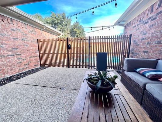 Outdoor patio space with seating and plants