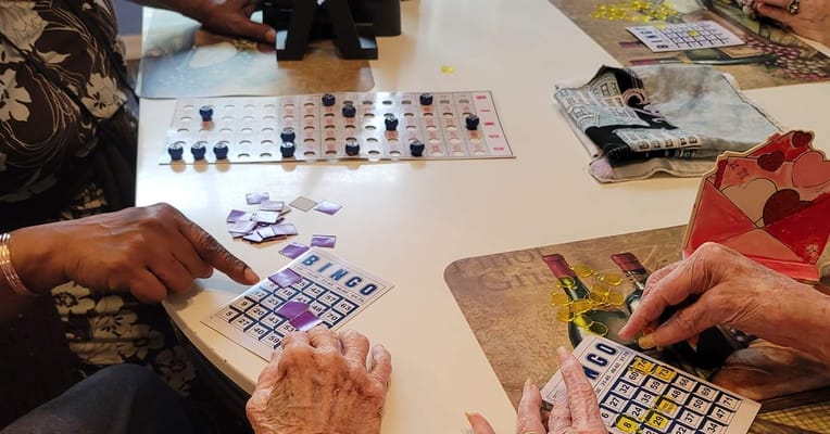 Residents playing bingo at a table