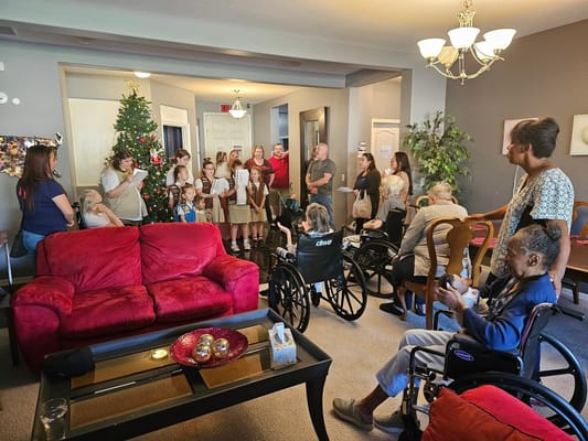 Residents and staff gather for a holiday celebration